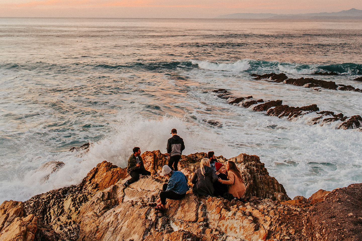 A group of friends hanging by the shore