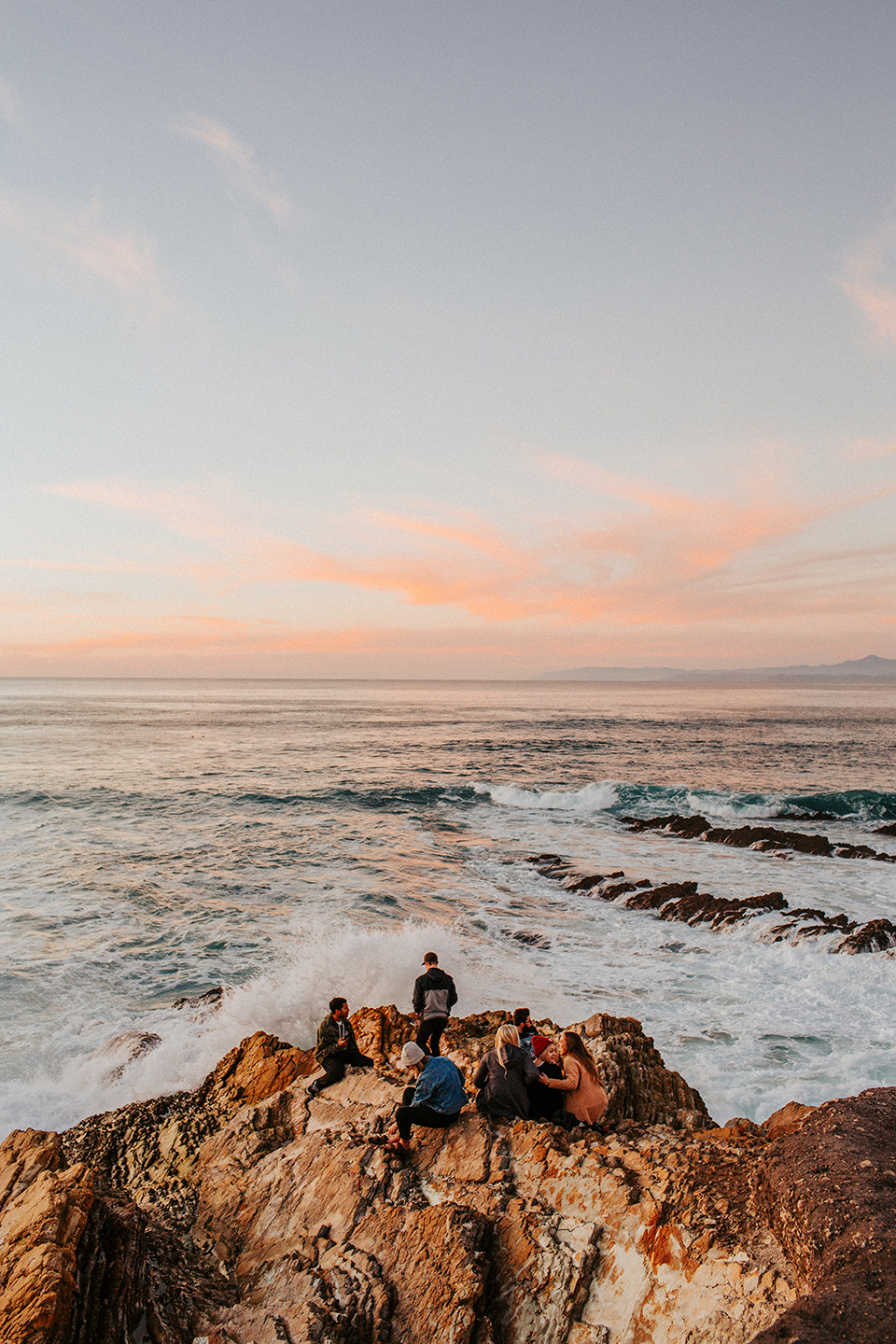 A group of friends hanging by the shore